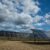 Solar panels used for renewable energy on the field under the sky full of clouds